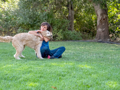KESIMPTA Crew member Kristin playing with her dog