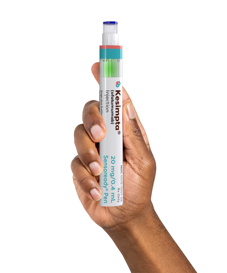 Hand holding the KESIMPTA® auto-injector pen
